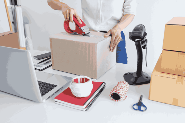 A person packing delivery boxes v3