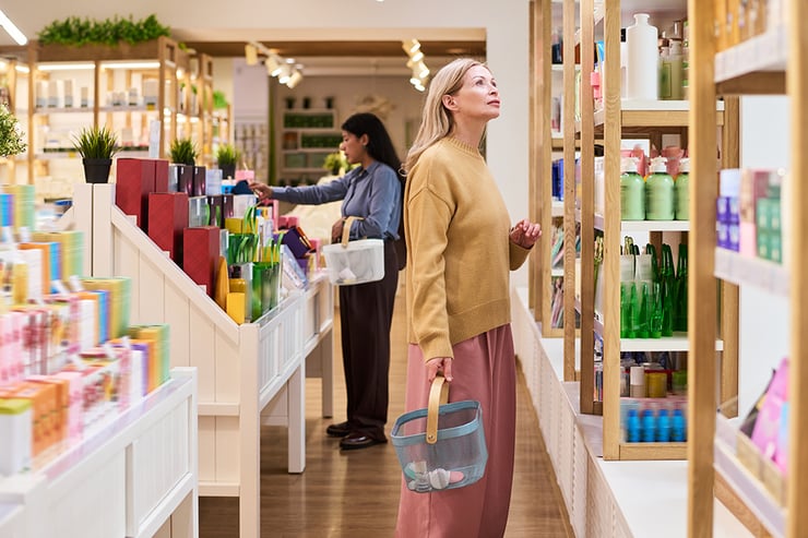 an image of a woman looking up at a shelf