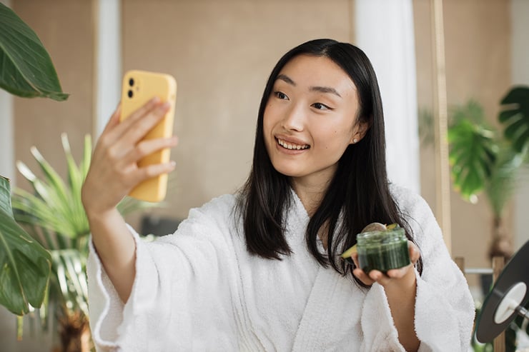 an image of woman taking a selfie