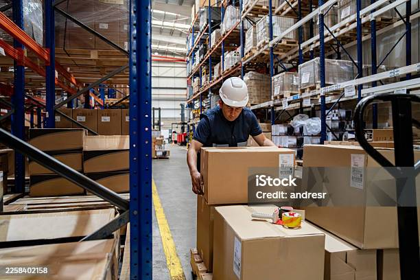 Employees restocking a warehouse