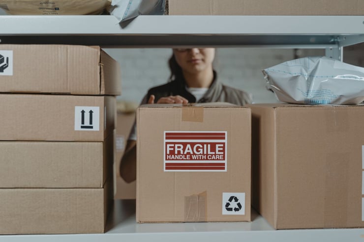 Fragile Box Being Handled by Staff