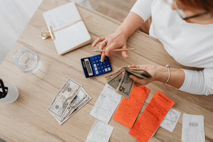 Image of Seller Computing Sales and Expenses