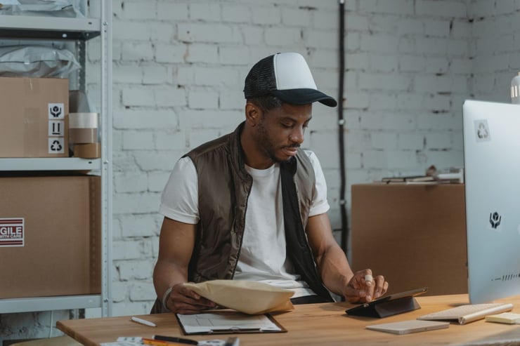 Image of an Amazon seller packing orders