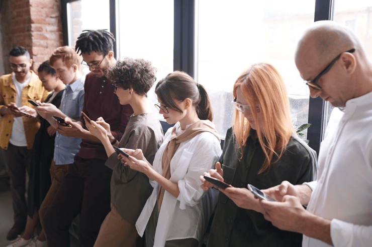 Multiple People Holding Phones