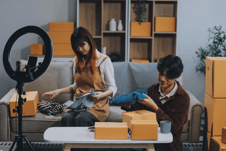 Two people packing and livestreaming v3