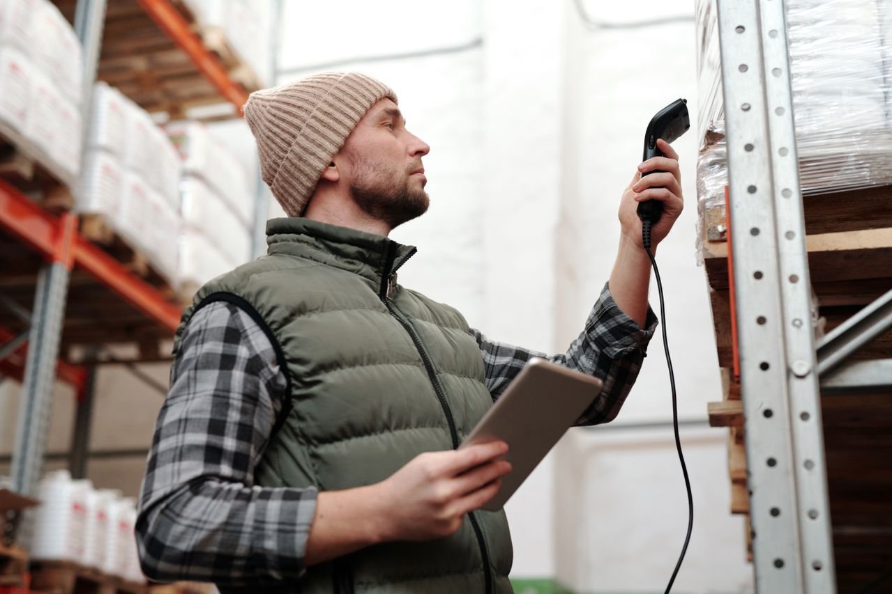 man scanning product inventory
