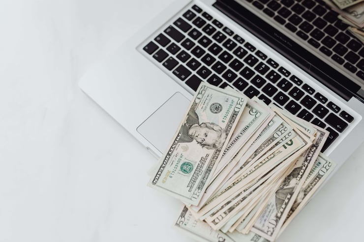 an image showing bills on a laptop