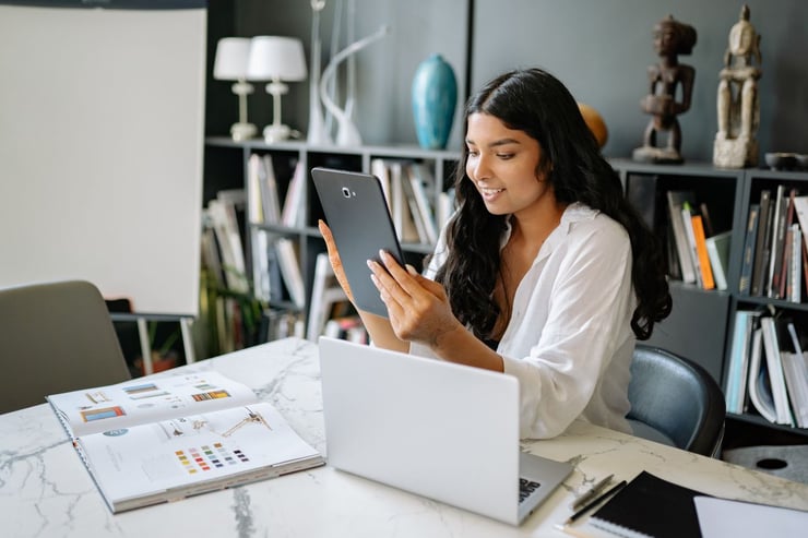 an image showing a woman holding a tablet